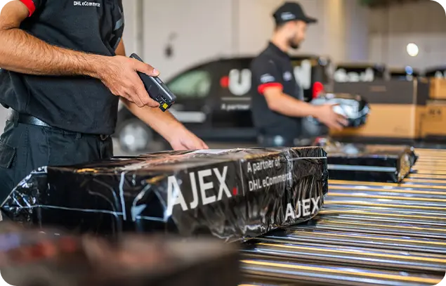 AJEX employee scanning the barcode of the shipments 