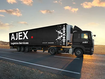 A black truck from AJEX cold chain trailer driving on a road